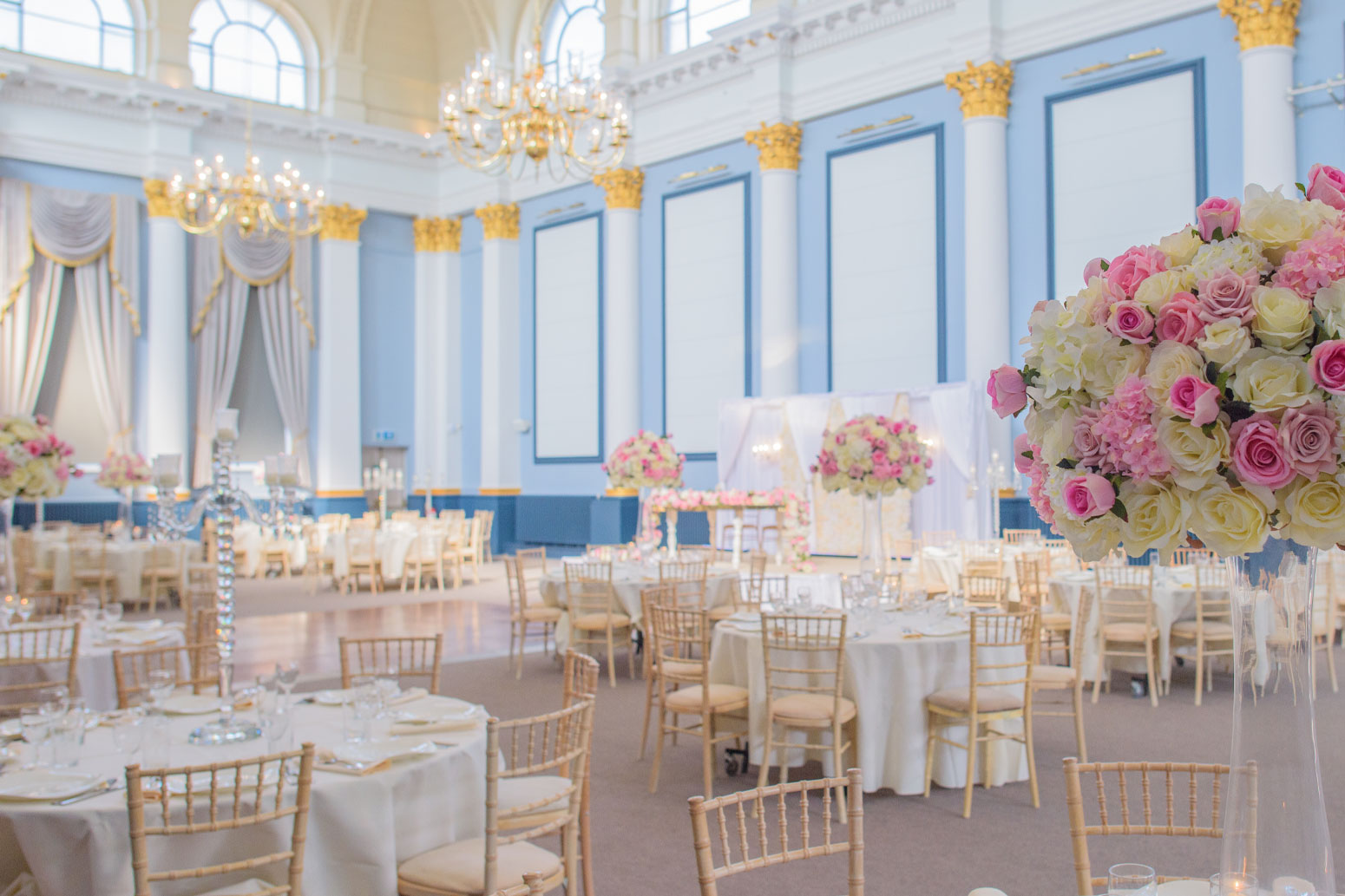 A dining area with flowers at the Corn Exchange.