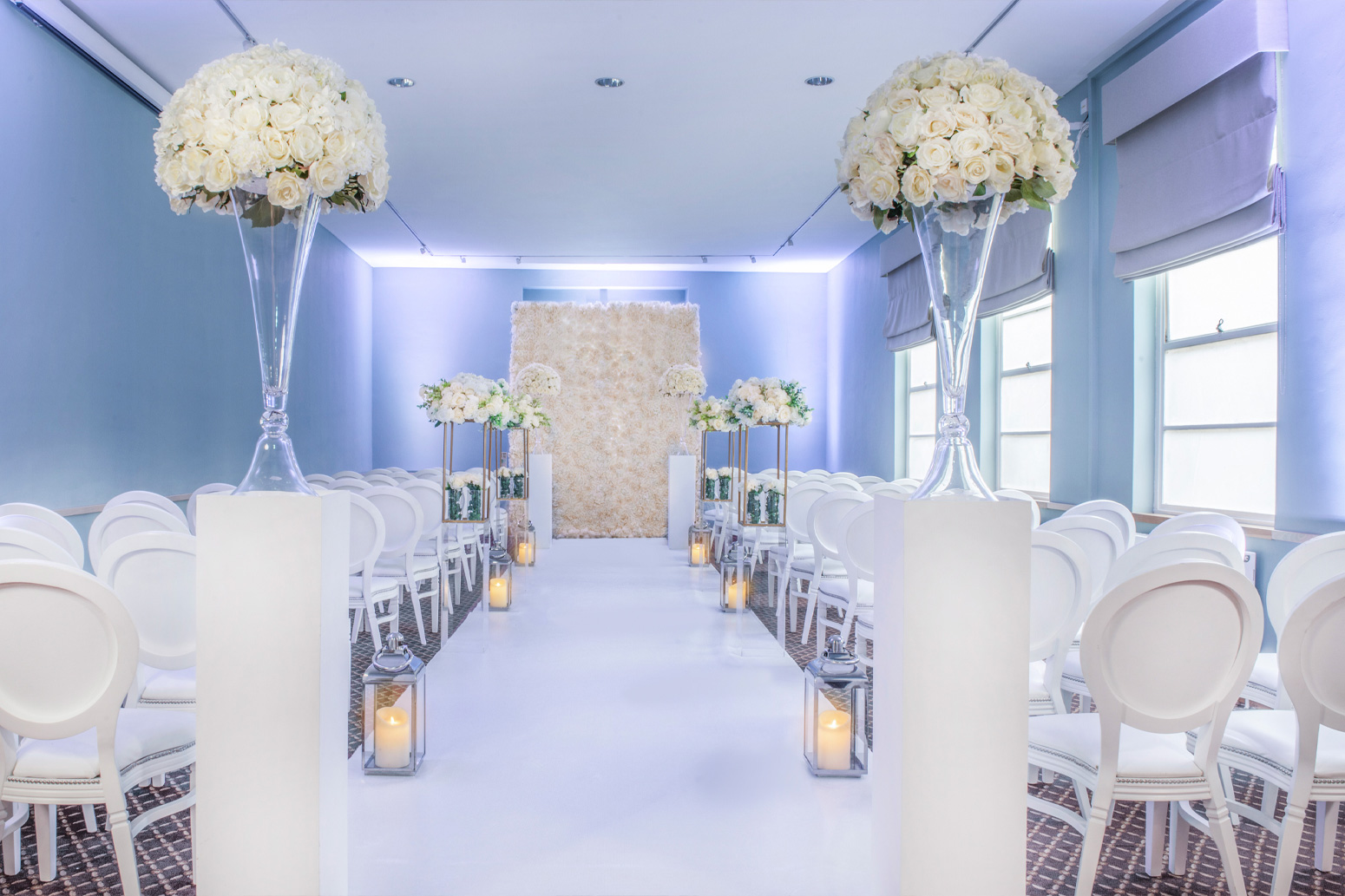 The wedding venue decorated in white.