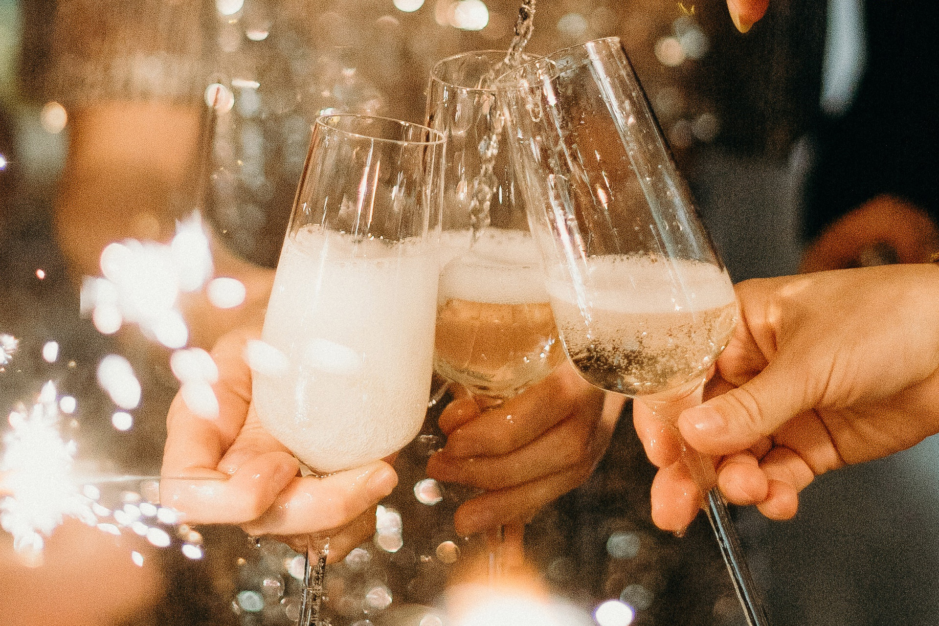 A group of people raising their glasses.